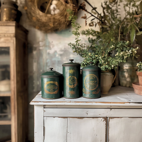 Set of vintage green canisters decorated with IOD Figgy & Flourish gold foil transfer holiday labels and motifs