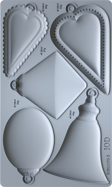Silicone mould render of the IOD Bibelots 2 showing mirror-image cavities and detailed designs.