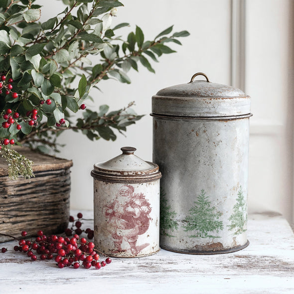 Example of Christmas Wishes stamp designs applied to vintage metal tins with Santa and Christmas tree motifs.