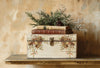 Project example using IOD Santa’s Hollow Transfer on a vintage box with bells and holly designs.
